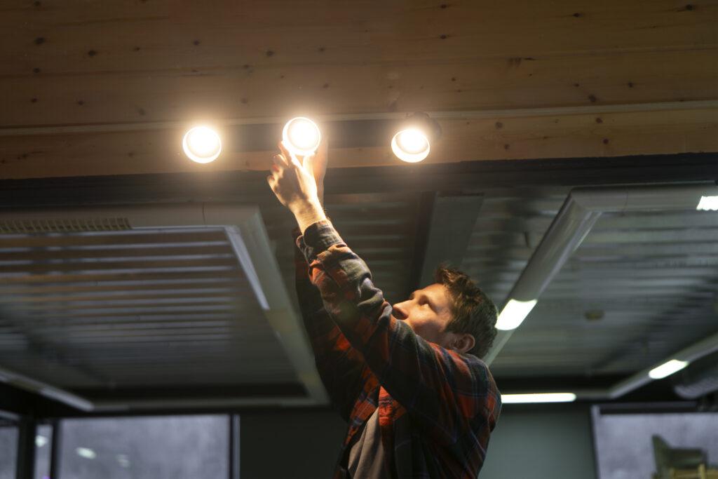man installing lighting