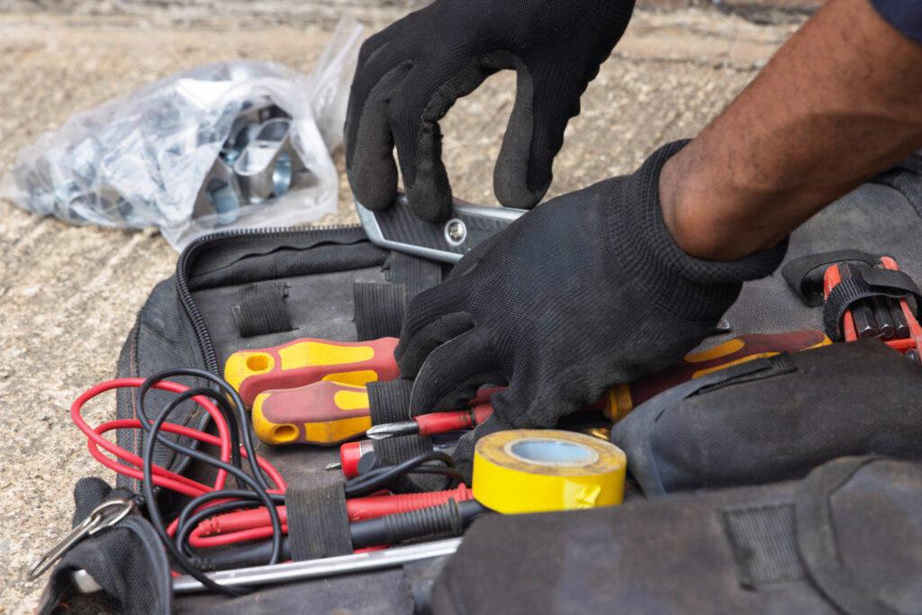 hands picking up tools
