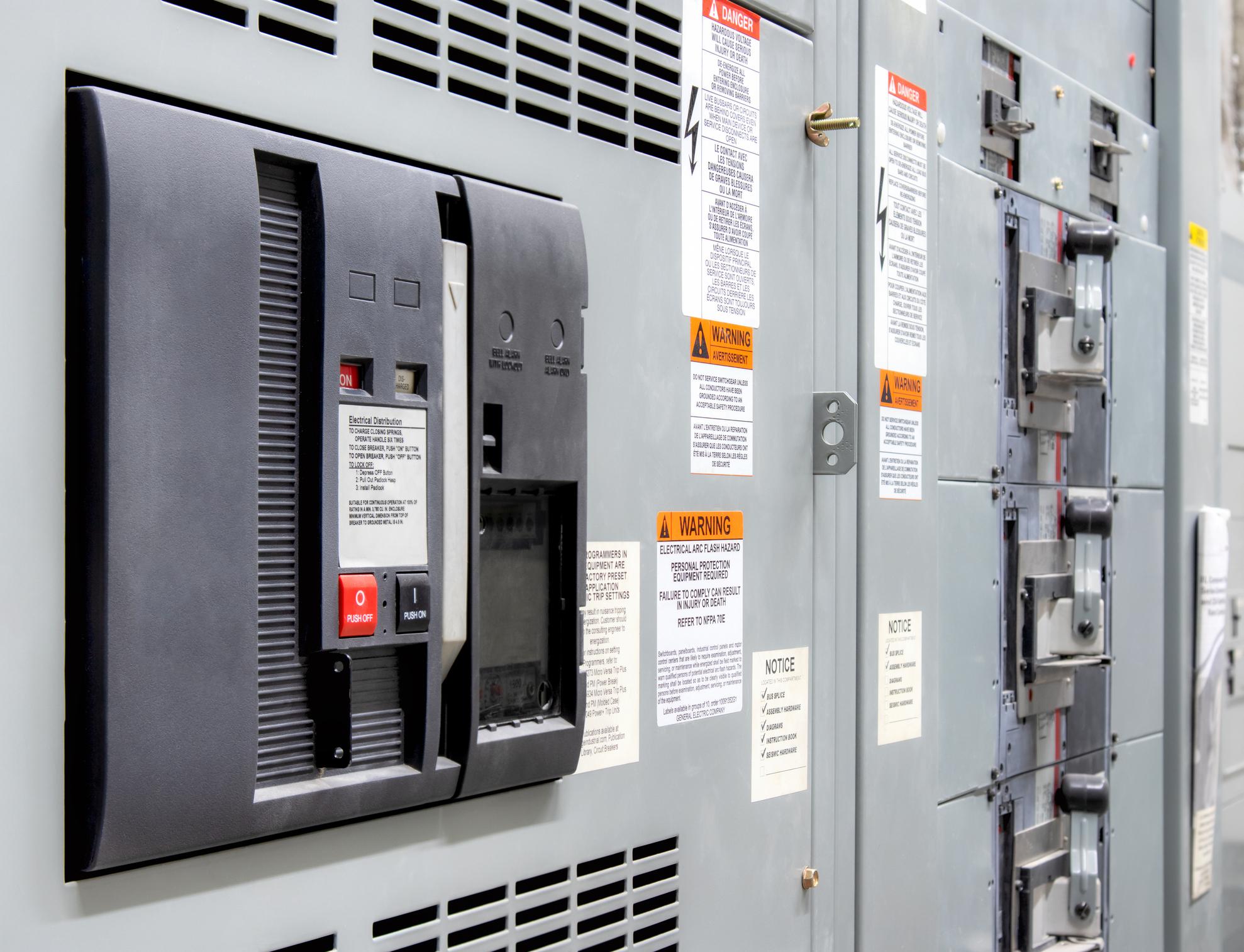 Main power breaker in electrical room of residential or commercial building.
