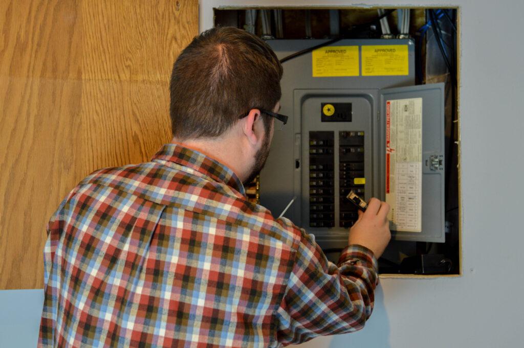 Man inspecting electrical box