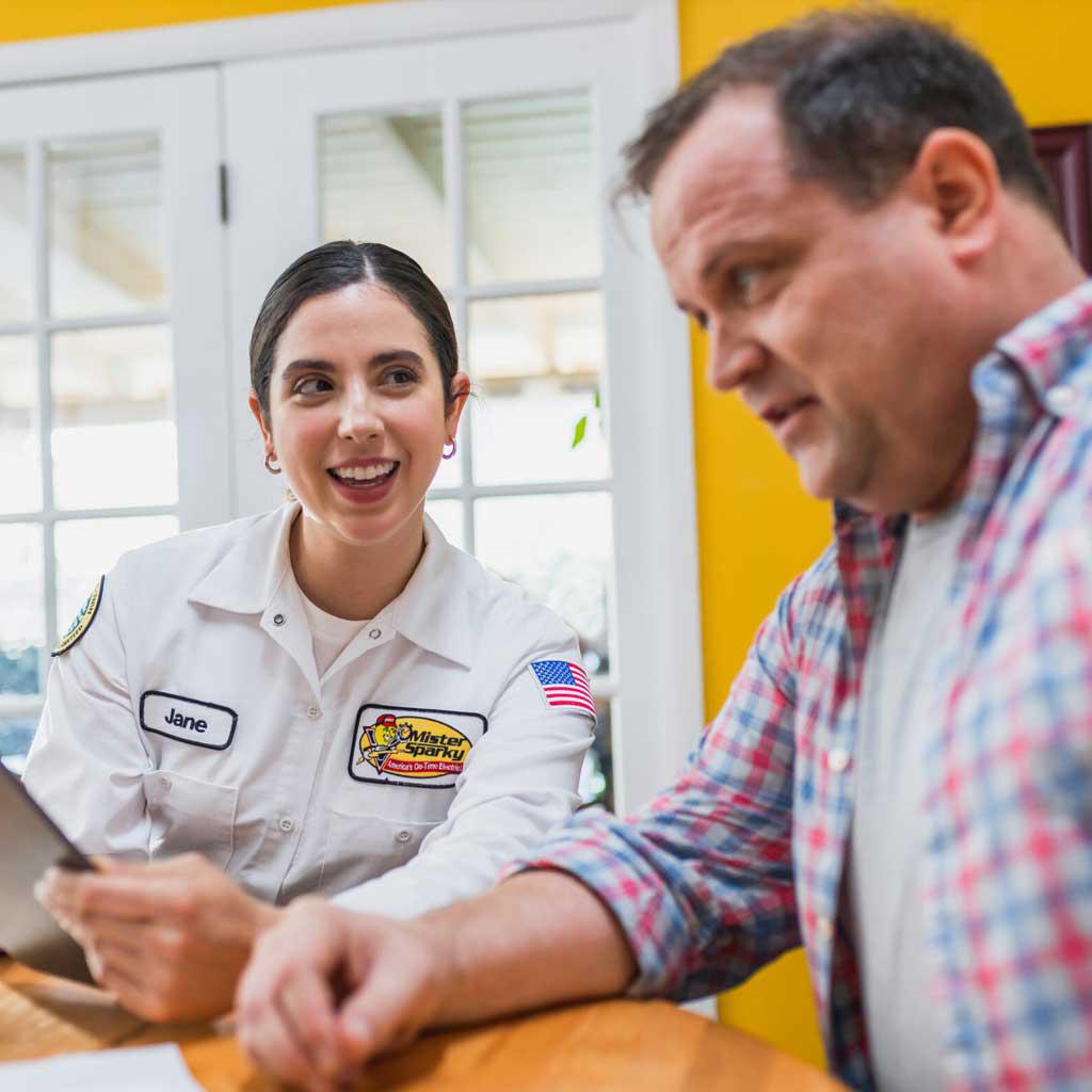 electrician smiling at homeowner